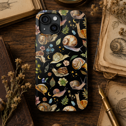 Phone case with snail design on a wooden surface with books and magnifying glass