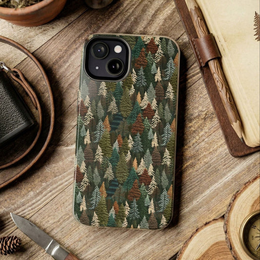 Phone case with forest pattern on a wooden surface with camera and nature items